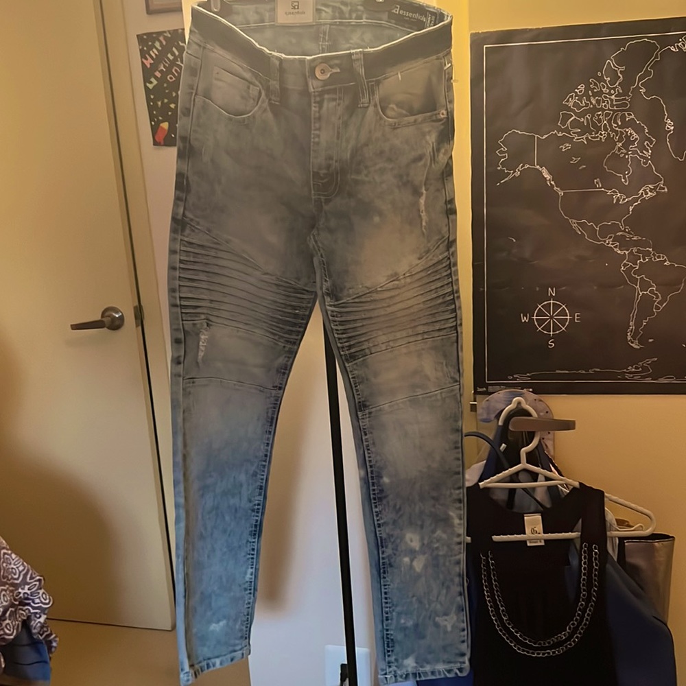 One pair Jeans. Mens jeans faded blue color.